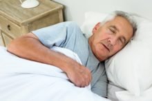High angle view of old man sleeping